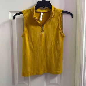 Hi, I’m selling a small, mustard yellow top.